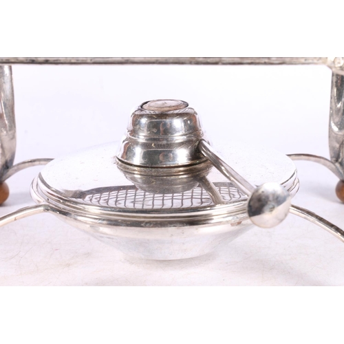 44A - White metal warming stand with burner, retailed by Harrods of London, 28cm across the handles.