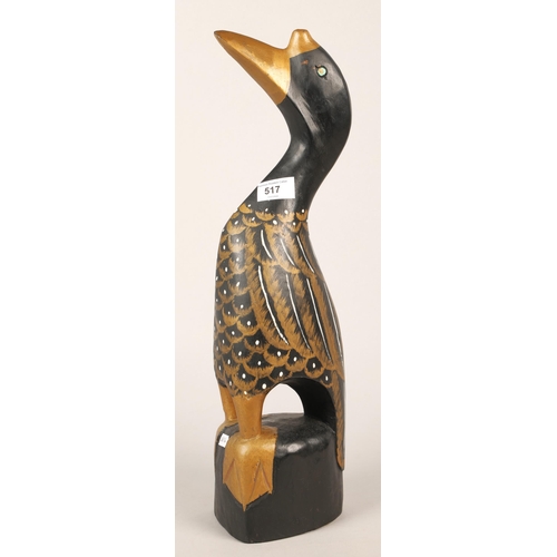 517 - Hardwood black and gold figure of a duck, approx. 50cm height