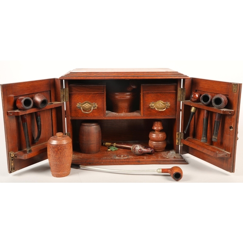 535 - Small smoking cabinet with pipes and other smoking-related ephemera