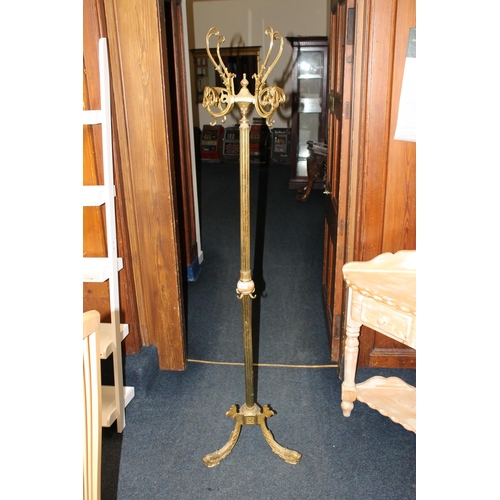 421 - 20th century brass and onyx coat stand raised on three dolphin supports, 175cm tall.