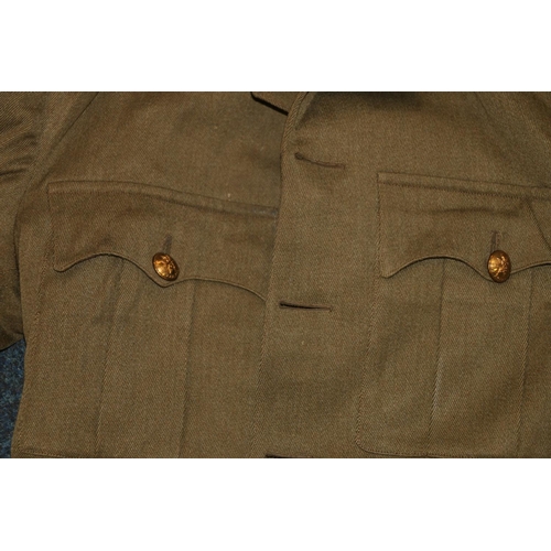 349E - British army green khaki jacket having Royal Scots brass buttons and collar buttons and lower sleeve... 