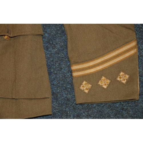 349E - British army green khaki jacket having Royal Scots brass buttons and collar buttons and lower sleeve... 