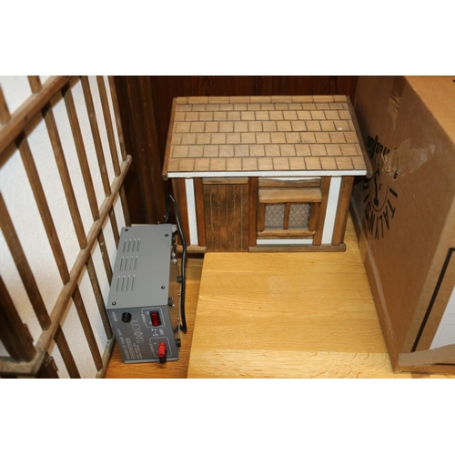 412 - Large mock Tudor style dolls house with accessories, 122cm long.