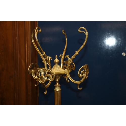 421 - 20th century brass and onyx coat stand raised on three dolphin supports, 175cm tall.