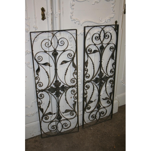 292 - Two wrought iron fence panels, 106cm x 39cm.