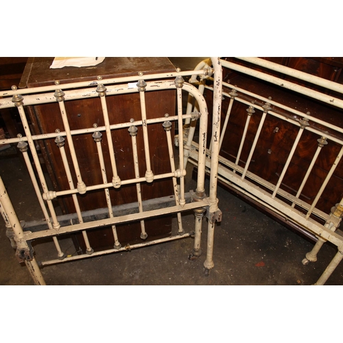 253A - Two Victorian wrought iron painted single bed frames.