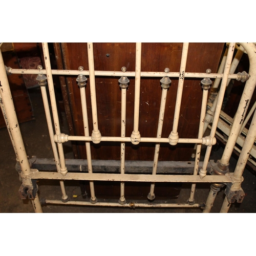 253A - Two Victorian wrought iron painted single bed frames.