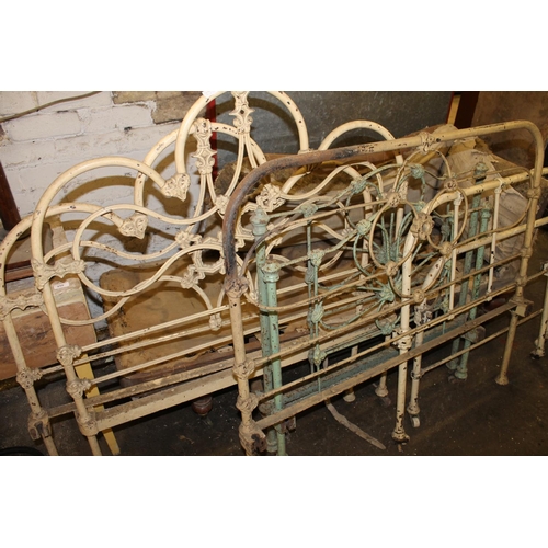 253B - Three Victorian wrought iron single bed frames.