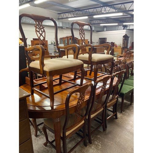 553 - Cherrywood dining room extendable table, six chairs, pair of carvers (9)