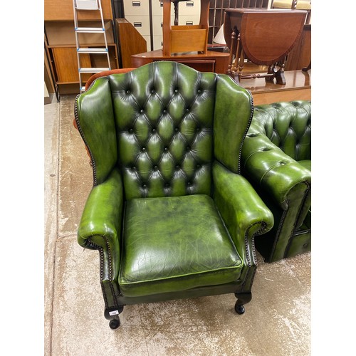 559 - Three seater green leather Chesterfield settee, Green leather matching arm chair, Green leather wing... 