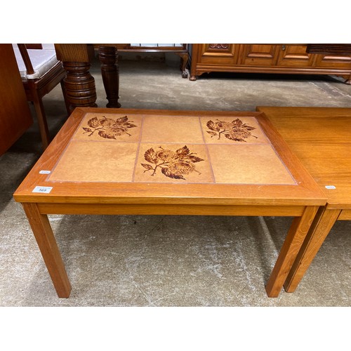 569 - Tile topped teak occasional table, 51 x 71 x 42 cm 