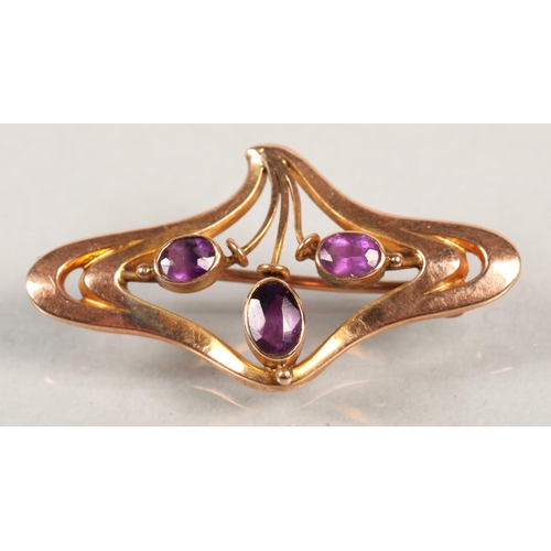 46 - 9ct gold brooch with three amethyst stone, 1.7g