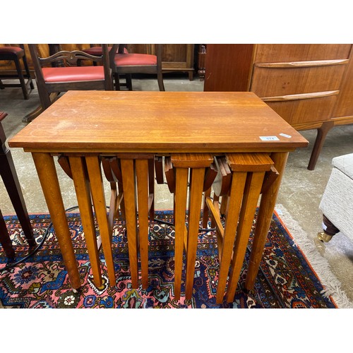 574 - Teak nest of four drop leaf folding tables