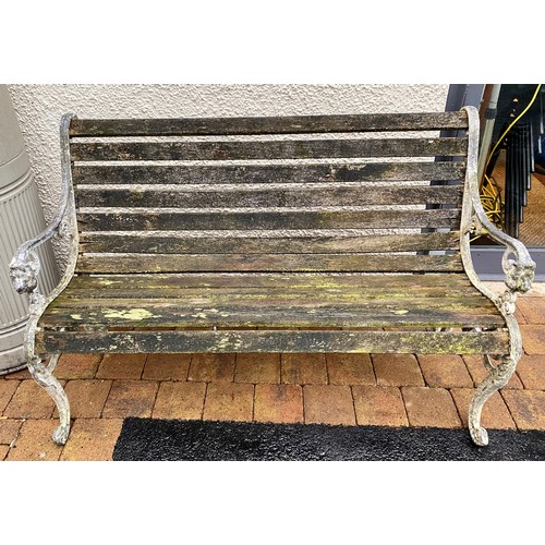 489 - Garden seat with wrought iron ends