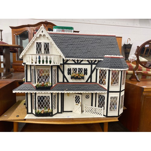 607 - Vintage dolls house with furnishings