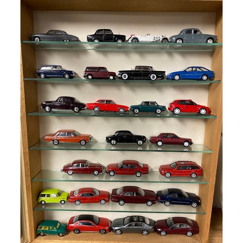 231 - Wall mounted display cabinet containing various Corgi and other model cars