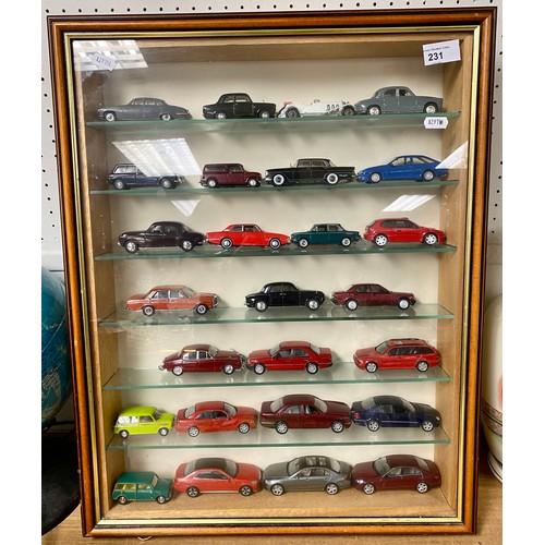 231 - Wall mounted display cabinet containing various Corgi and other model cars