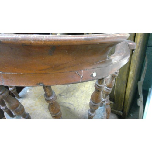 261 - Antique smokers bowl style chair with spindle back, saddle seat, raised on turned baluster supports.