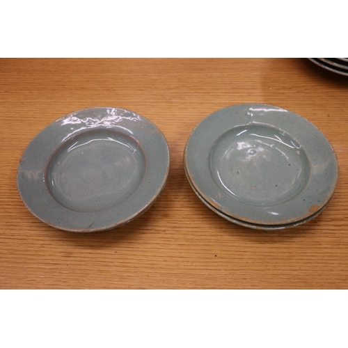 135 - Celadon tin glazed earthenware dishes, 20cm and 17cm diameter.