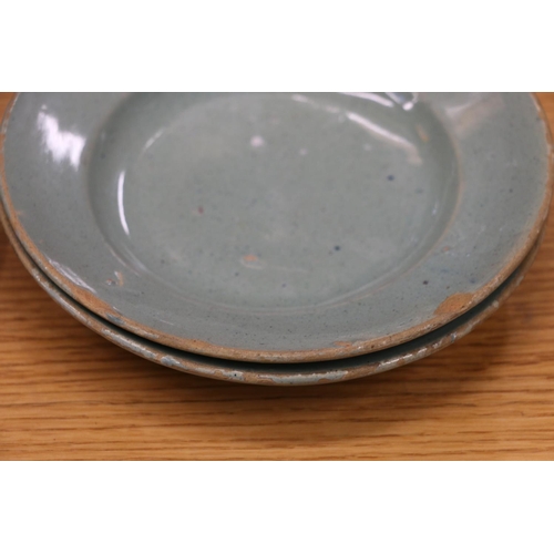 135 - Celadon tin glazed earthenware dishes, 20cm and 17cm diameter.