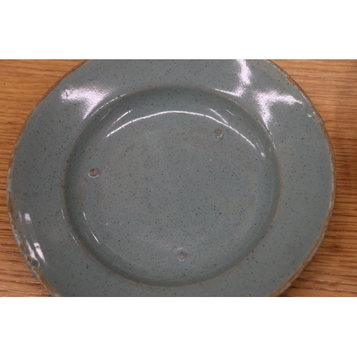 135 - Celadon tin glazed earthenware dishes, 20cm and 17cm diameter.