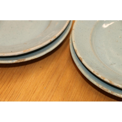 135 - Celadon tin glazed earthenware dishes, 20cm and 17cm diameter.