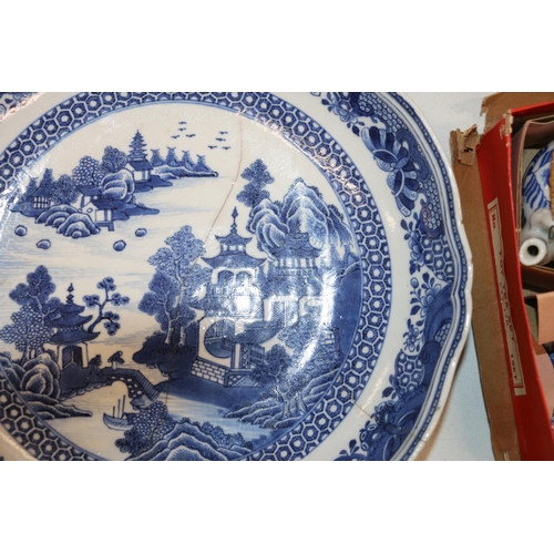 137 - Four Chinese blue and white dishes decorated with pavilion and garden scenes, 25cm and 23cm diameter... 