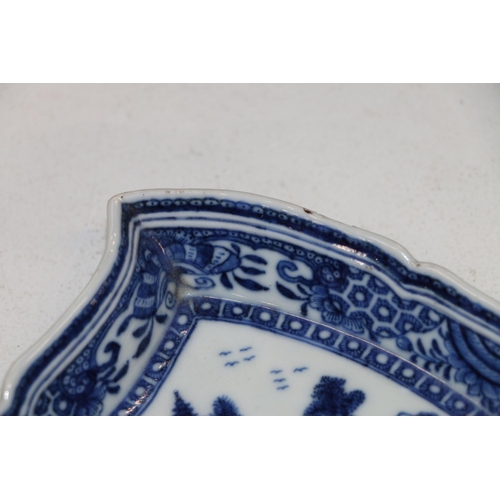 139 - Chinese blue and white porcelain dish of boteh form decorated with pavilion garden scene, 19cm high.