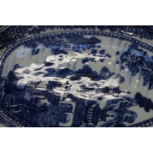 139 - Chinese blue and white porcelain dish of boteh form decorated with pavilion garden scene, 19cm high.