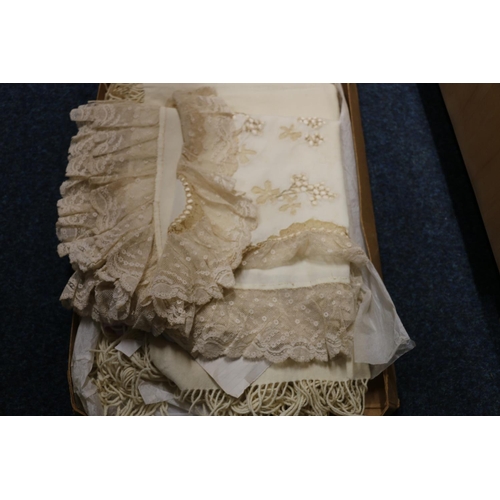 321 - Quantity of linens and lace to include robes, veil, etc.