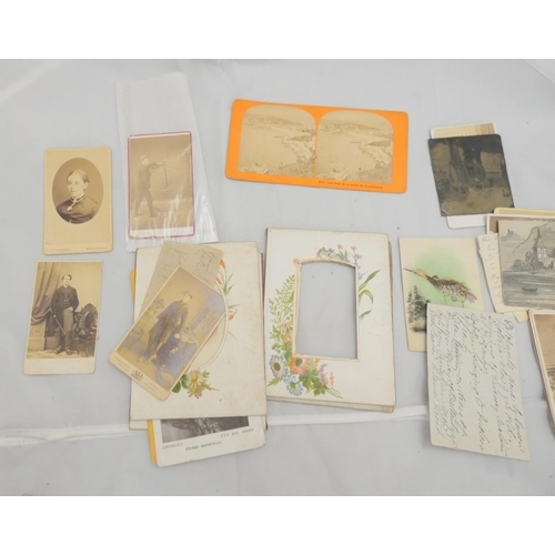 259 - Photographs.  A small bundle of carte-de-visite & stereoscope photographs & related items.... 