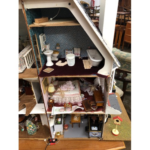 607 - Vintage dolls house with furnishings