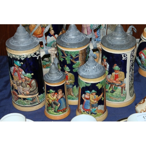 11 - Steins of varying sizes, largest 42cm high.  (9)