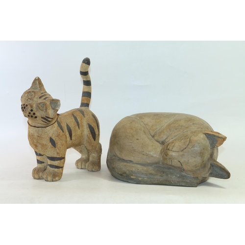 31 - Stoneware model of a cat, 29cm high and a carved treen model of a sleeping cat.