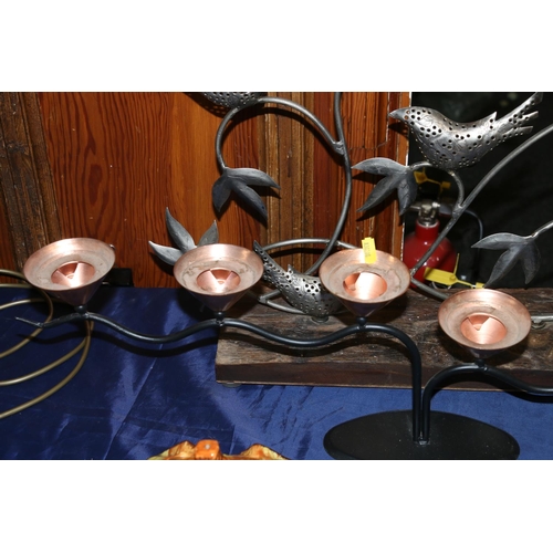 42 - Contemporary tealight candle holder formed as birds seated on branches mounted on a rustic plinth, a... 