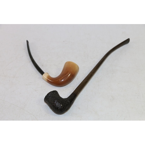 101 - Carved wooden bowled smoking pipe and a clay smoking pipe.