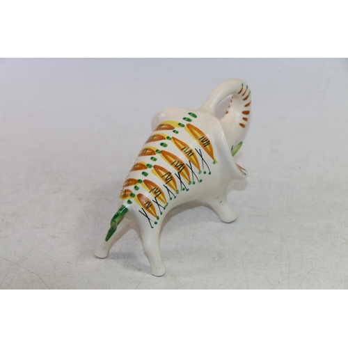 103 - Mid-20th century retro ceramic model of an elephant with abstract decoration, 19cm.