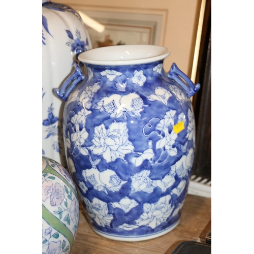 105 - Continental blue and white vase and cover, and three other pottery vases and jars, largest 49cm.