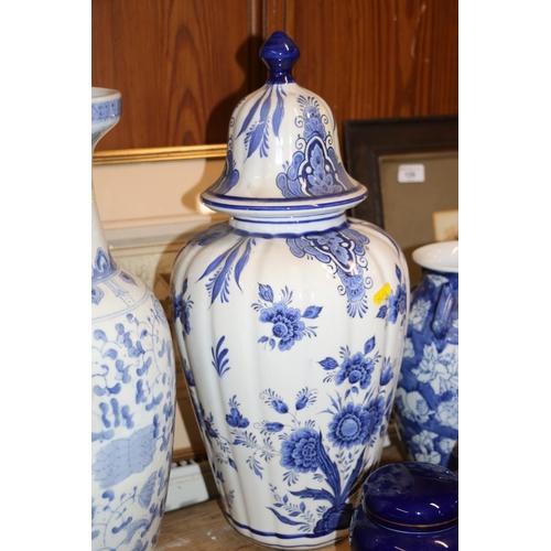 105 - Continental blue and white vase and cover, and three other pottery vases and jars, largest 49cm.