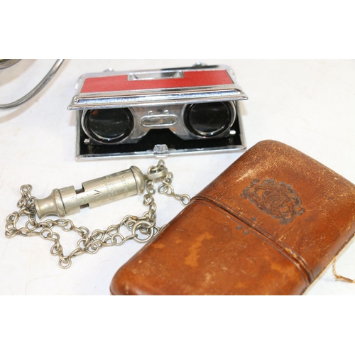 111 - Mid-20th century bicycle lamp with a military torch, a leather cigar case, opera glasses, and a metr... 