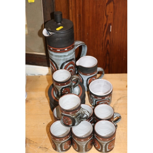 113 - 1970s Studio Pottery coffee set comprising a coffee pot, a milk jug, a sugar bowl and eights cups an... 