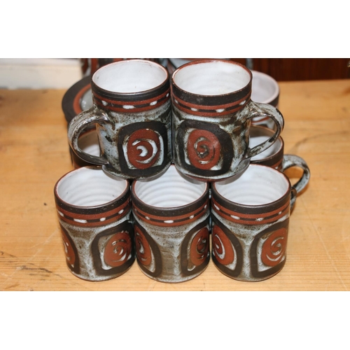 113 - 1970s Studio Pottery coffee set comprising a coffee pot, a milk jug, a sugar bowl and eights cups an... 