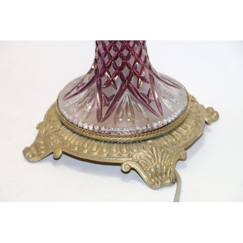 117 - Moulded glass and brass base lamp.