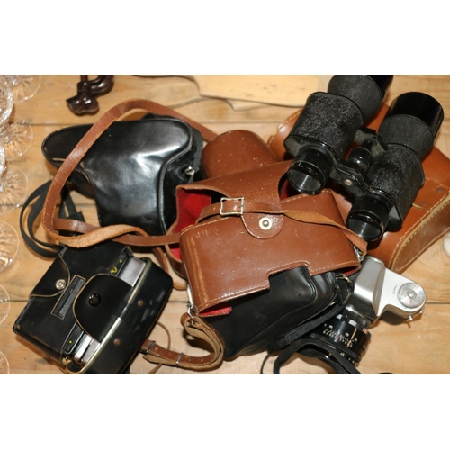 123 - Vintage cameras and binoculars to include a Zenit 3M, etc.