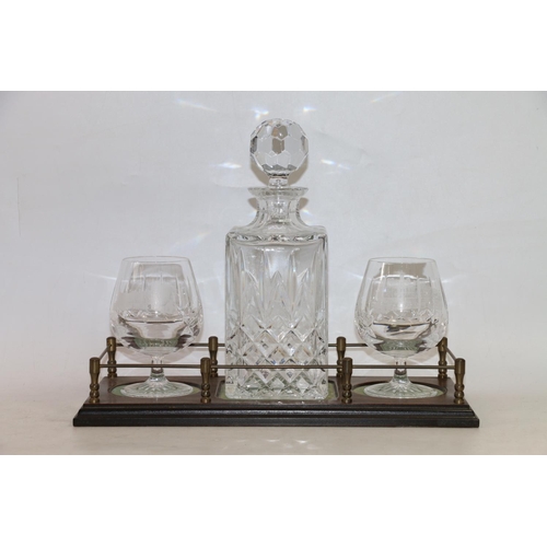 125 - Glass decanter and a pair of brandy glasses with Edinburgh and Balmoral castle etchings, on mahogany... 