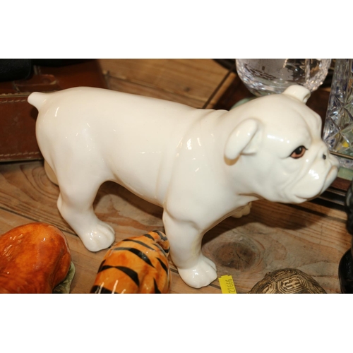 126 - Ceramic models  to include a white bulldog, 17cm, a black cat, wild animals, and others.