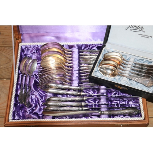 129 - Cased sets of cutlery to include dessert spoons, dinner knives and forks, teaspoons, etc.