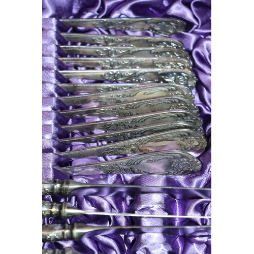 129 - Cased sets of cutlery to include dessert spoons, dinner knives and forks, teaspoons, etc.