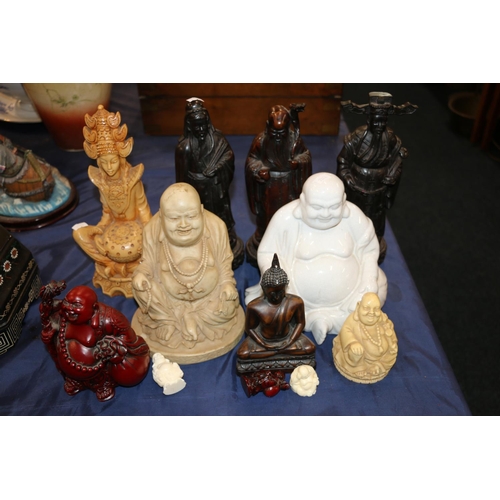 131 - Three Chinese carved hardwood figures and other oriental Buddha and scholar figurines, largest 27cm ... 