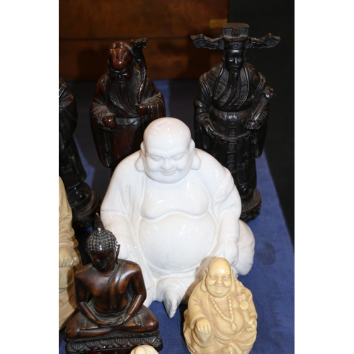 131 - Three Chinese carved hardwood figures and other oriental Buddha and scholar figurines, largest 27cm ... 